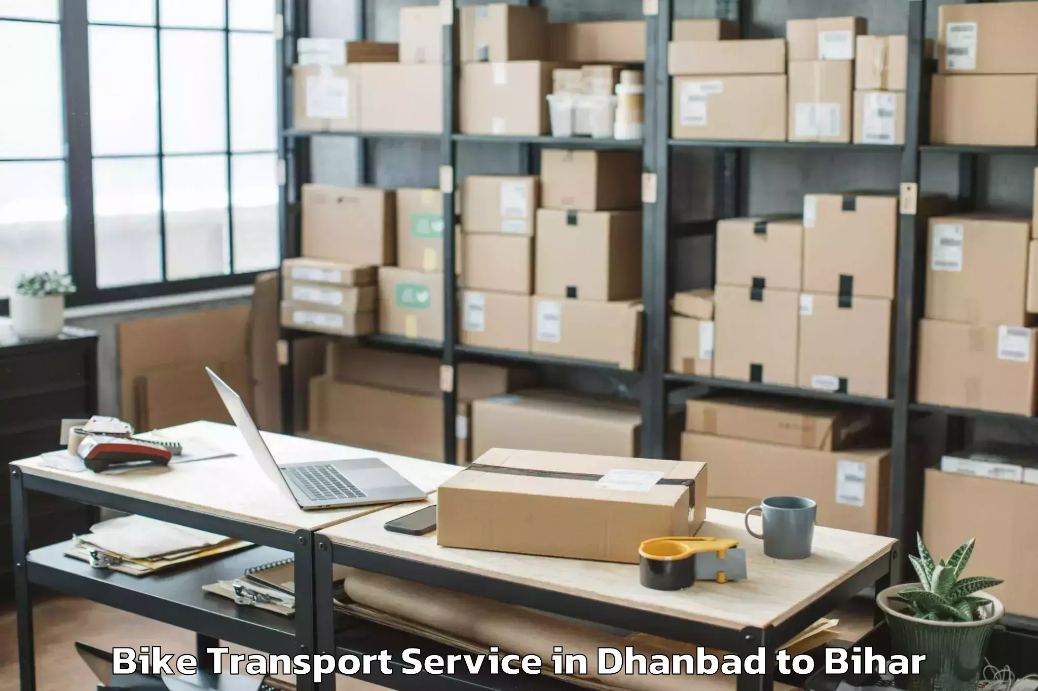 Easy Dhanbad to Wazirganj Bike Transport Booking